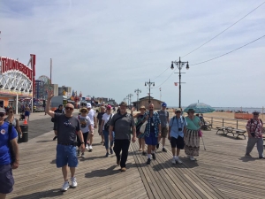 Group of people walking on the Coney Island Boardwalk, Brooklyn, NY