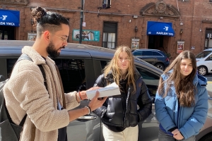 Asad Dandia reading a passage from Malcolm X's Autobiography chronicling Malcolm's first trip to Harlem on a "Malcolm X's Harlem" tour.